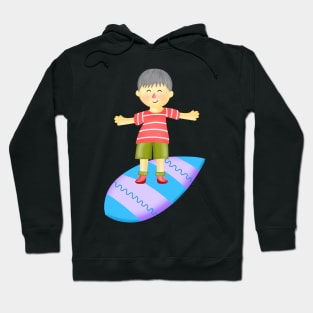 Little boy playing surfboard. Hoodie